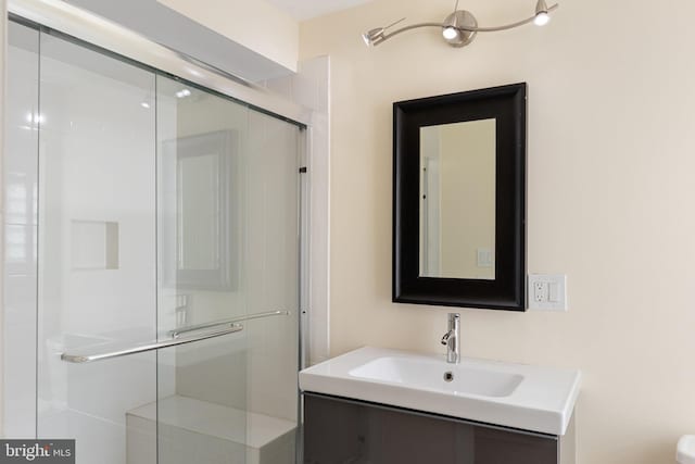 bathroom with vanity and an enclosed shower