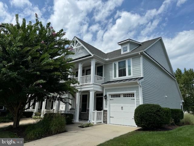 view of front of home featuring a garage and a porch