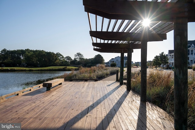 dock area featuring a water view and a pergola