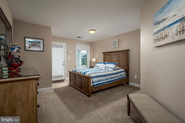 bedroom featuring visible vents, baseboards, and carpet