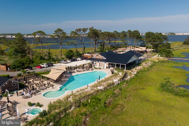 view of pool with a water view