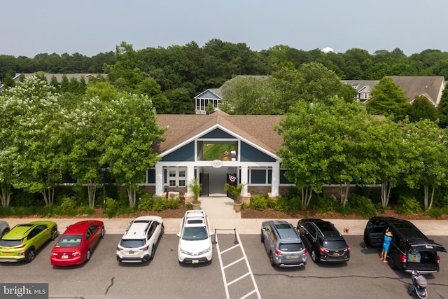 view of property with uncovered parking