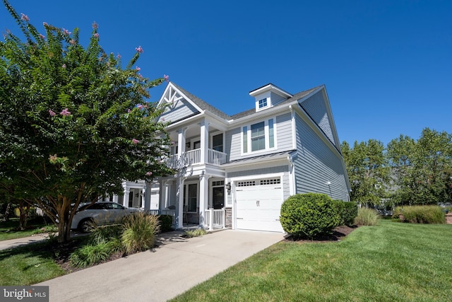 view of front of home with a garage, a porch, and a front lawn