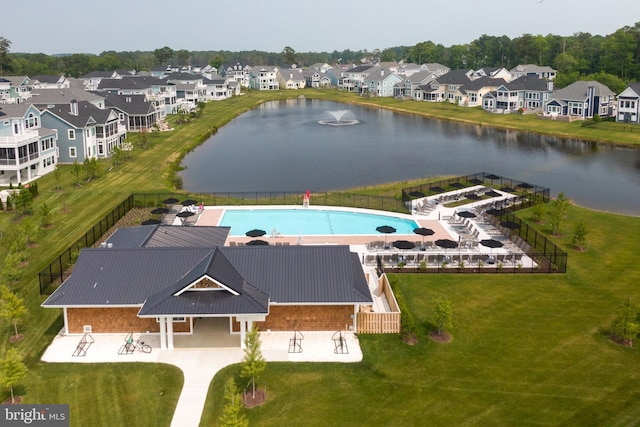 drone / aerial view featuring a residential view and a water view