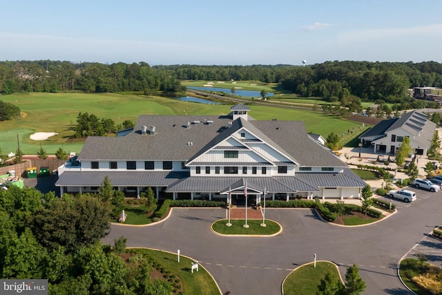 bird's eye view featuring view of golf course and a water view