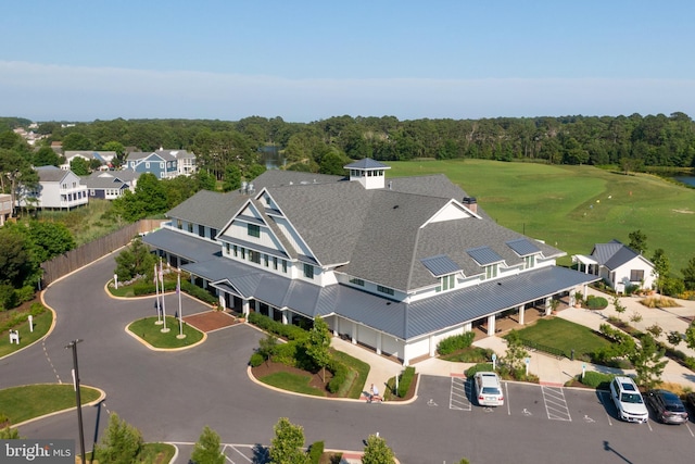 bird's eye view with a wooded view