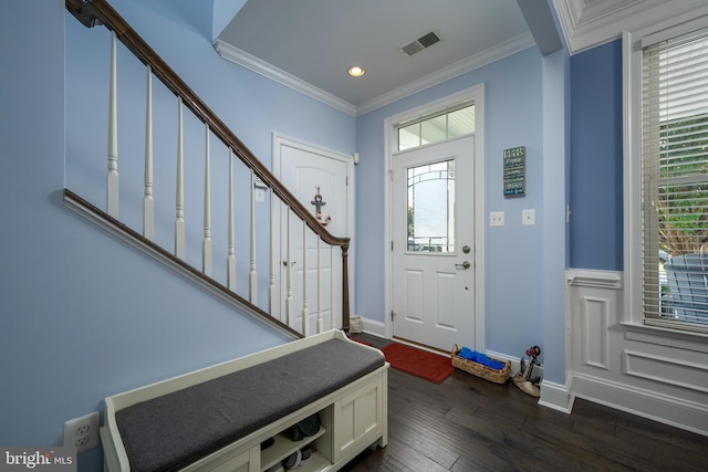 foyer entrance featuring visible vents, ornamental molding, dark wood-style floors, stairway, and baseboards