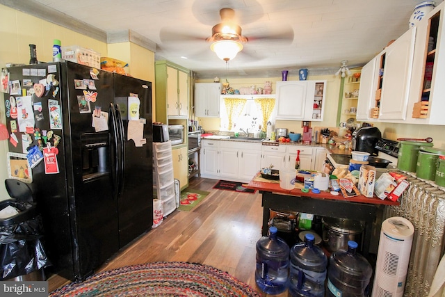 kitchen featuring black fridge with ice dispenser, a ceiling fan, white cabinets, open shelves, and dark wood finished floors