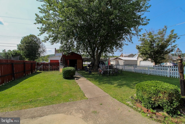 view of yard with a fenced backyard and an outdoor structure