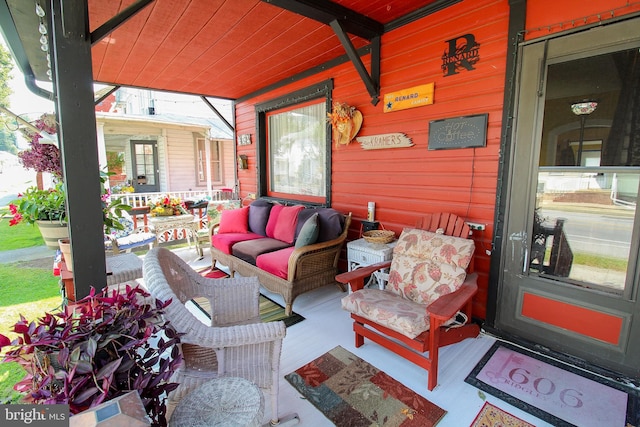 view of patio / terrace with a porch and an outdoor living space