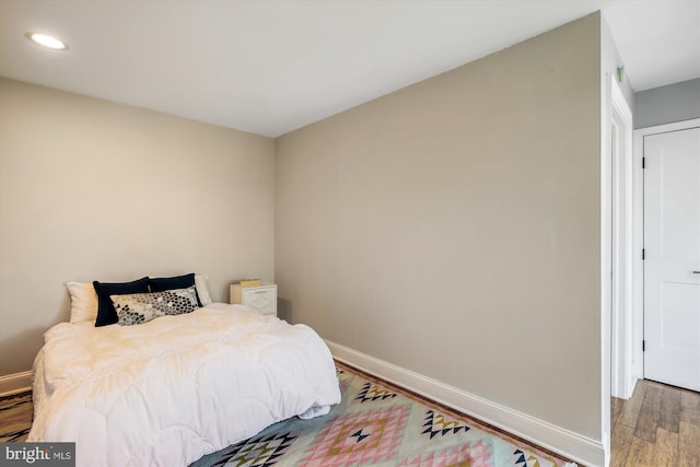 bedroom featuring hardwood / wood-style floors