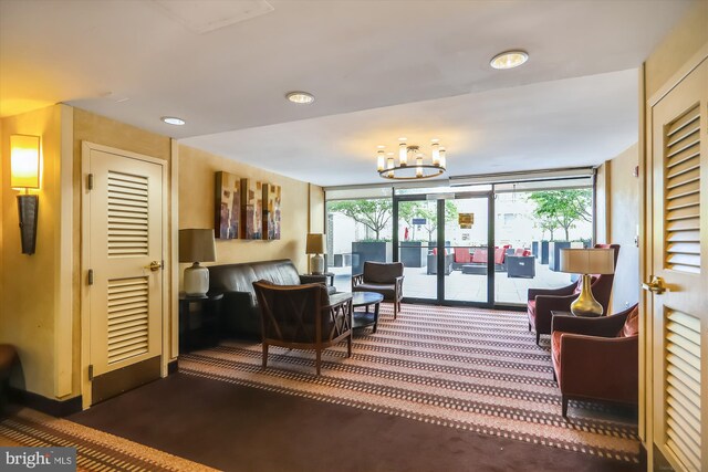 living room with an inviting chandelier