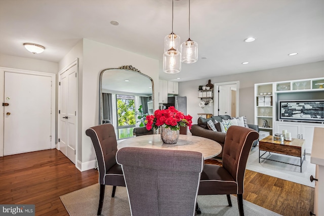 dining area featuring dark hardwood / wood-style floors