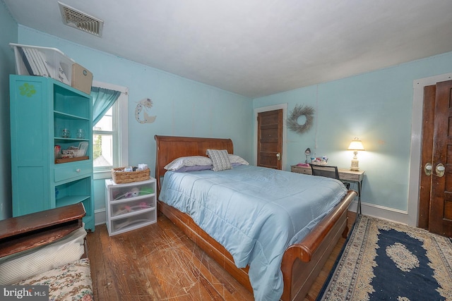 bedroom featuring dark hardwood / wood-style flooring