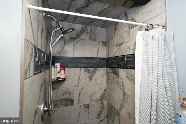 interior space with a shower with shower curtain