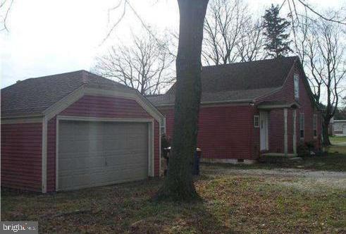 view of property exterior featuring a garage