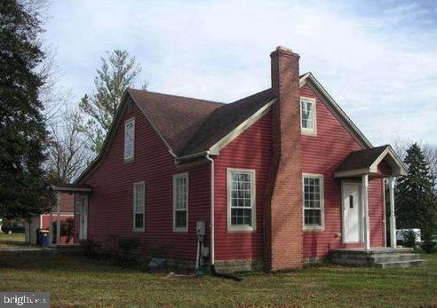 view of home's exterior with a lawn