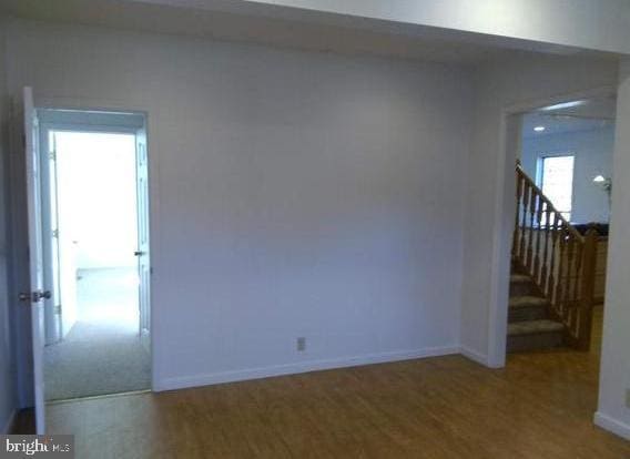 unfurnished room featuring hardwood / wood-style floors