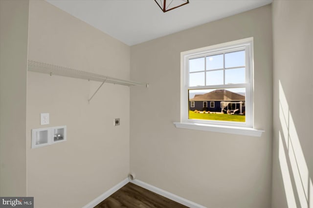 clothes washing area featuring baseboards, laundry area, hookup for a washing machine, electric dryer hookup, and dark wood-style flooring