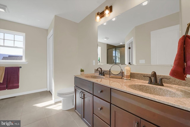 bathroom featuring tile patterned floors, a shower with shower door, vanity, and toilet