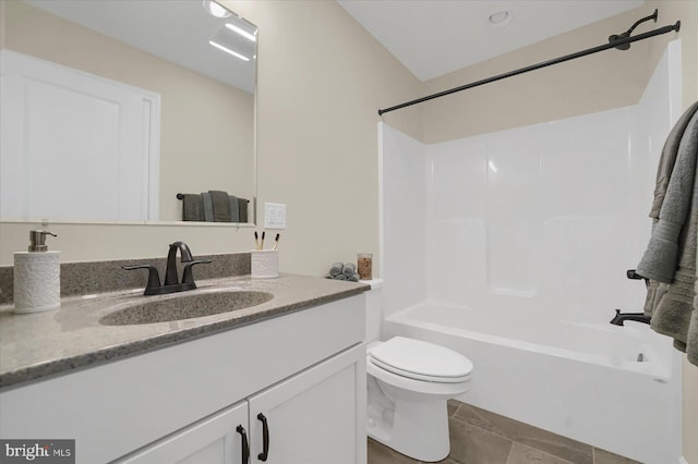 full bathroom with bathing tub / shower combination, vanity, and toilet