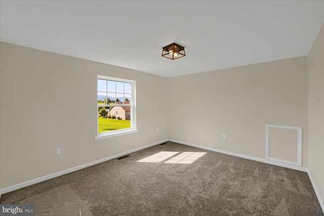 empty room featuring carpet flooring