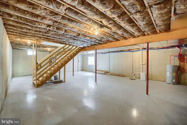 below grade area with stairway and electric water heater