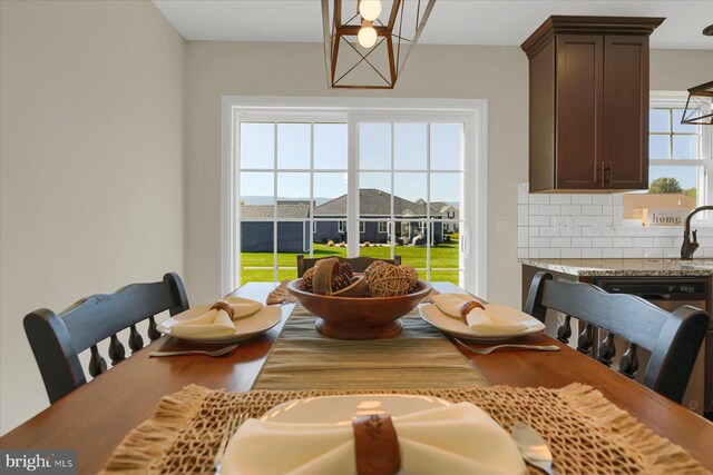 dining area featuring sink and a healthy amount of sunlight