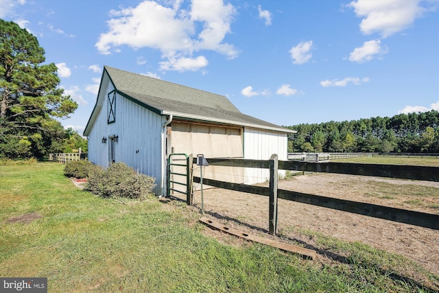 view of outbuilding with a yard