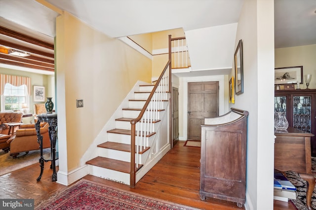 stairs with hardwood / wood-style floors