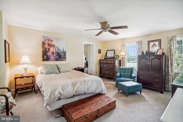 bedroom featuring ceiling fan and light colored carpet