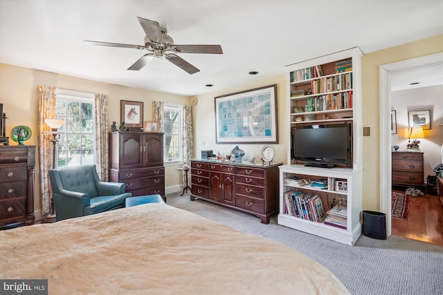 bedroom with ceiling fan and light hardwood / wood-style floors