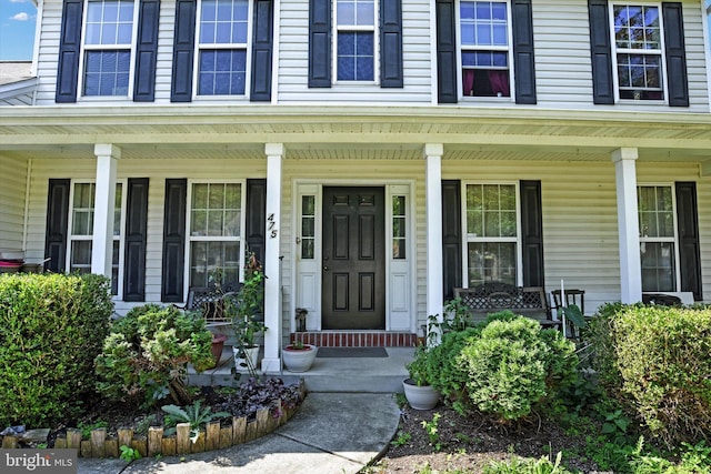 doorway to property featuring a porch