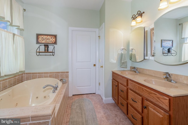 bathroom featuring double vanity, a jetted tub, a sink, and tile patterned floors