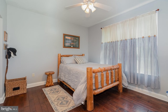 bedroom featuring wood-type flooring, baseboards, and ceiling fan