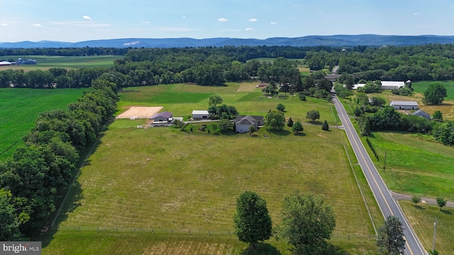 birds eye view of property with a mountain view and a rural view