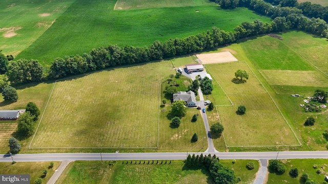 birds eye view of property with a rural view