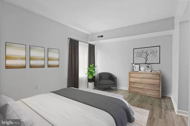 bedroom featuring light wood-type flooring