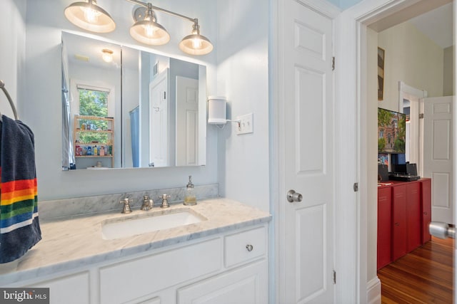 bathroom featuring hardwood / wood-style floors and vanity