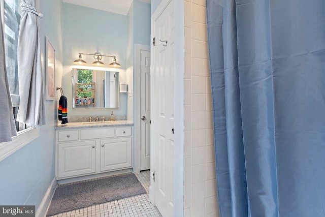 bathroom with tile patterned flooring and vanity