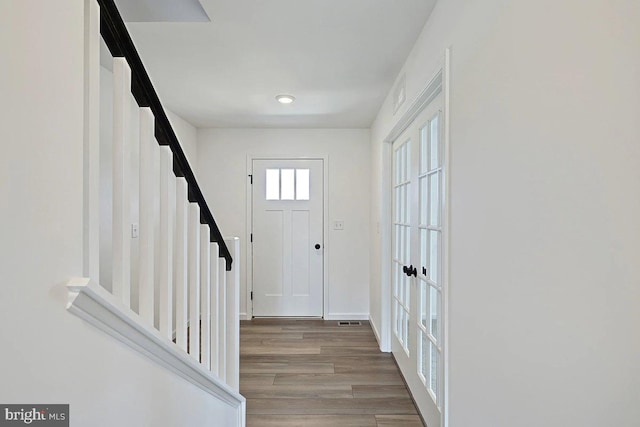 foyer entrance with wood-type flooring