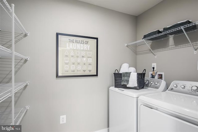 laundry room featuring separate washer and dryer