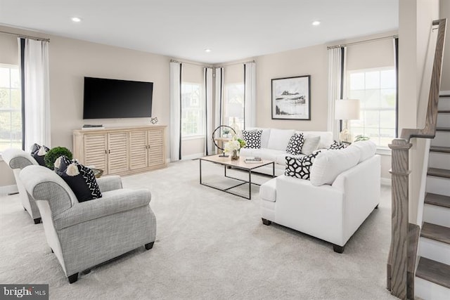 carpeted living room featuring a healthy amount of sunlight