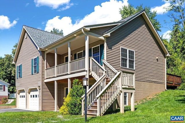 view of front of property featuring a garage and a front yard