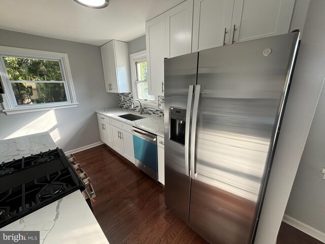 kitchen featuring backsplash, white cabinets, sink, and dark hardwood / wood-style flooring