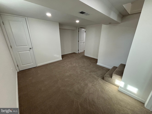 finished basement with visible vents, recessed lighting, baseboards, and carpet floors