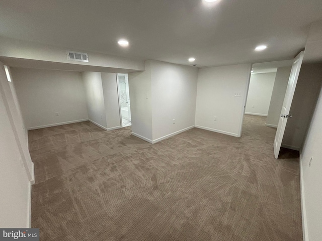 finished basement featuring recessed lighting, visible vents, carpet floors, and baseboards