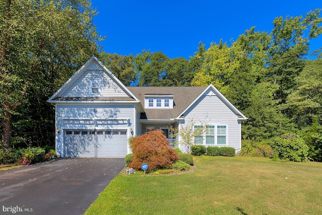 view of front of house with a front lawn and a garage