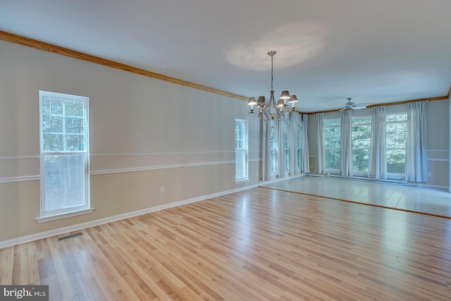 interior space with ceiling fan with notable chandelier, crown molding, light hardwood / wood-style flooring, and a wealth of natural light