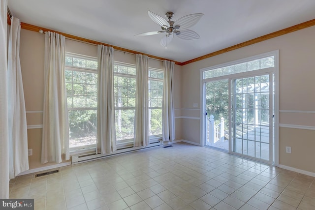 tiled empty room featuring ceiling fan, plenty of natural light, and ornamental molding